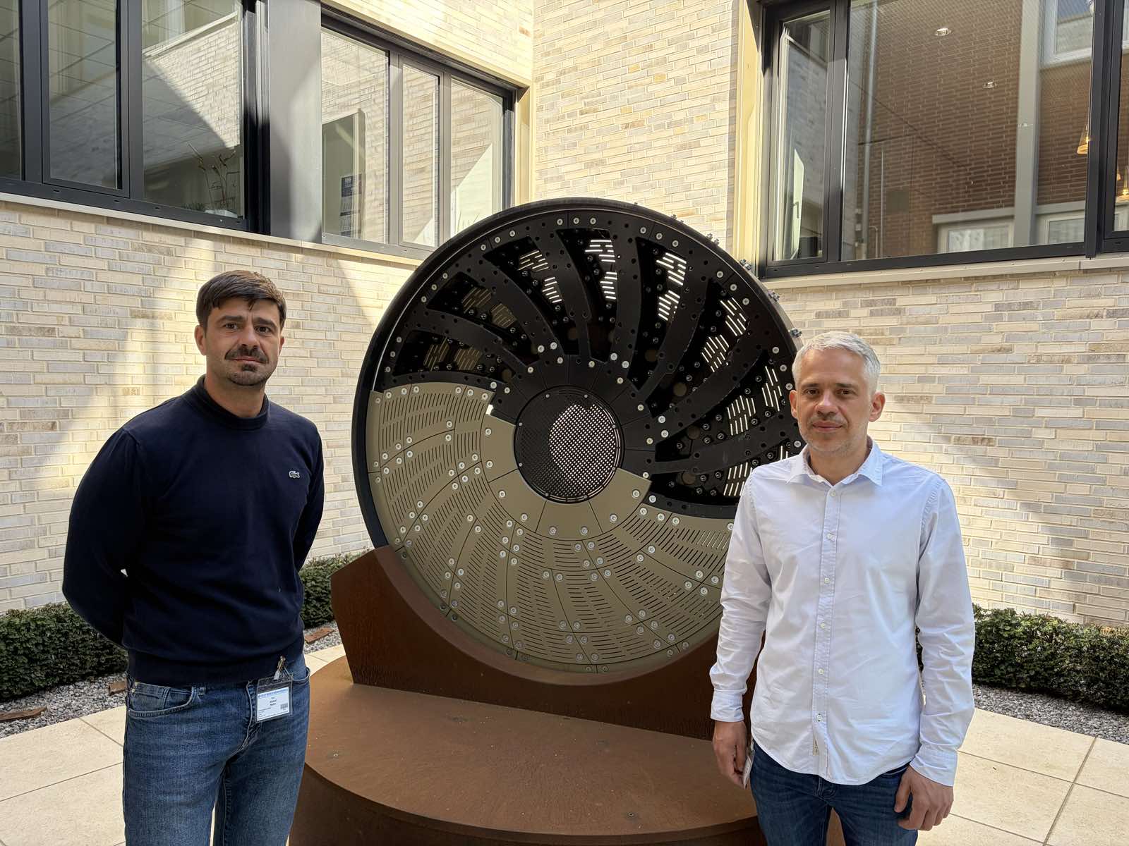 Kalisto representatives beside a mill diaphragm display at Christian Pfeiffer headquarters